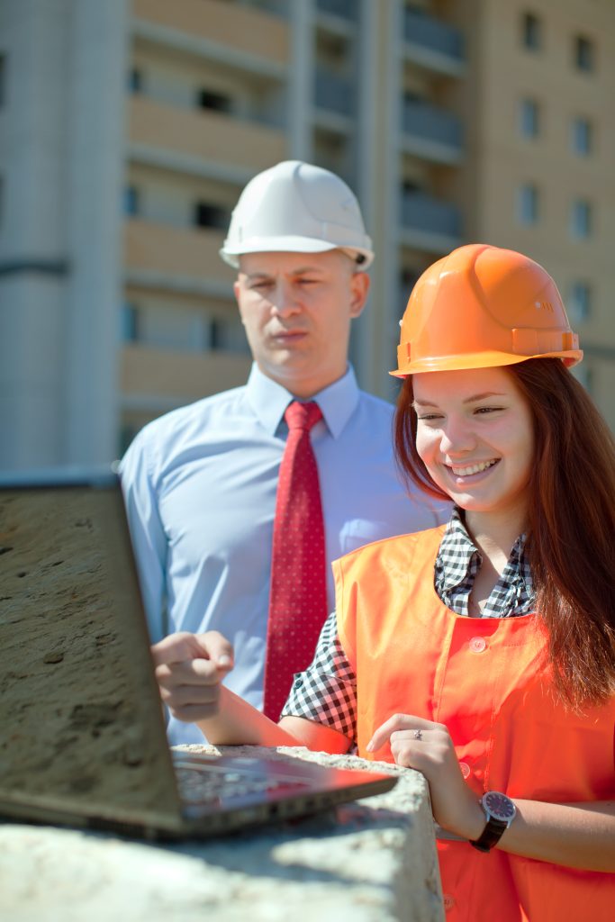 man and woman discussing prefabrication construction.