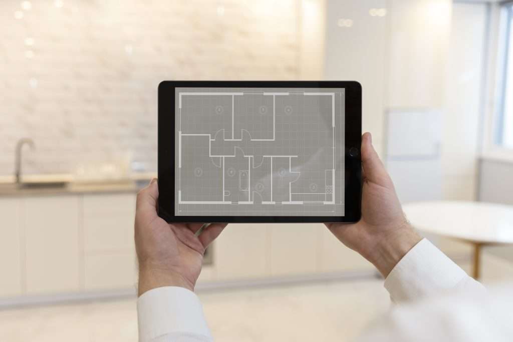 architect analyzing as built drawings on tablet for their project.
