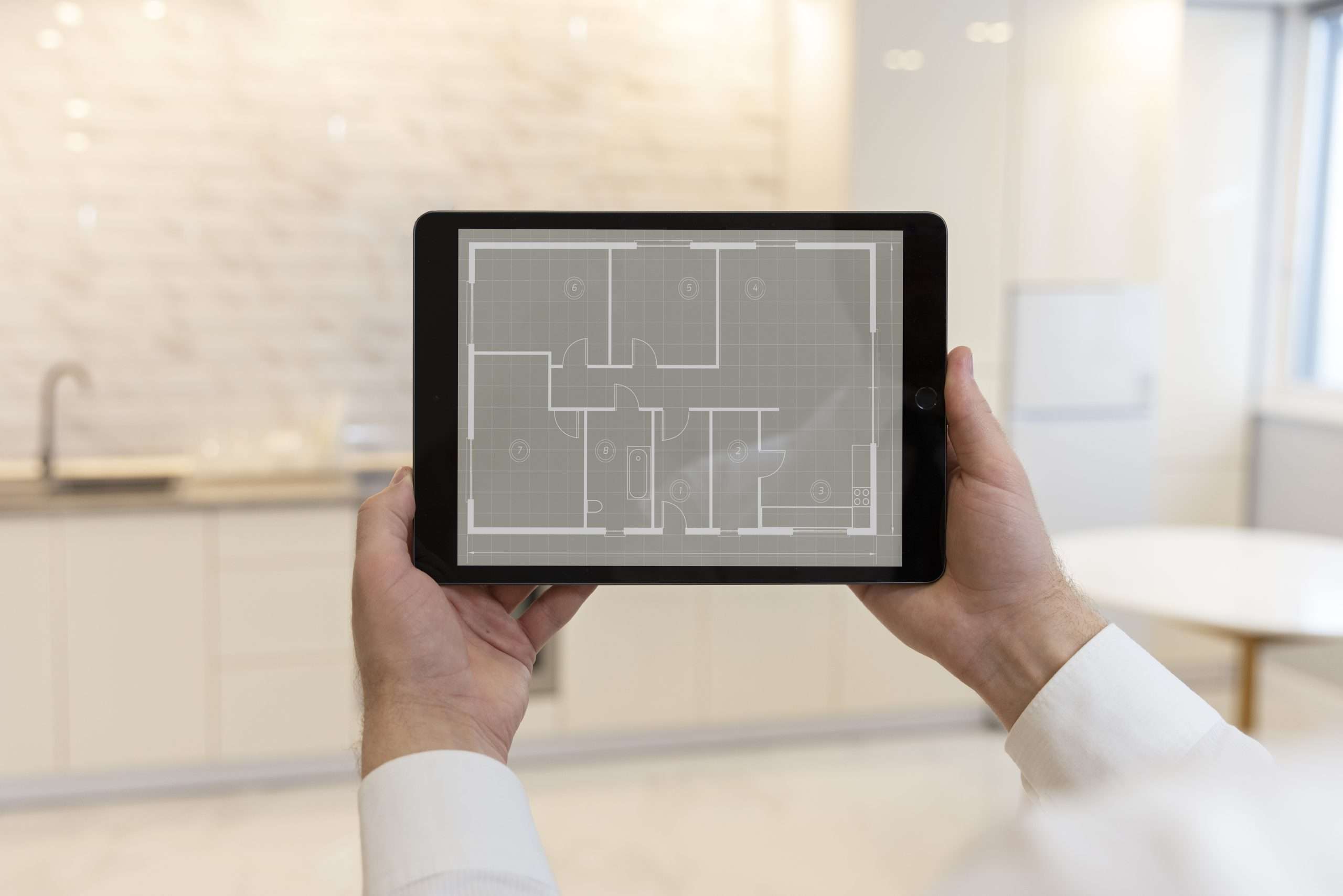 architect analyzing as built drawings on tablet for their project.