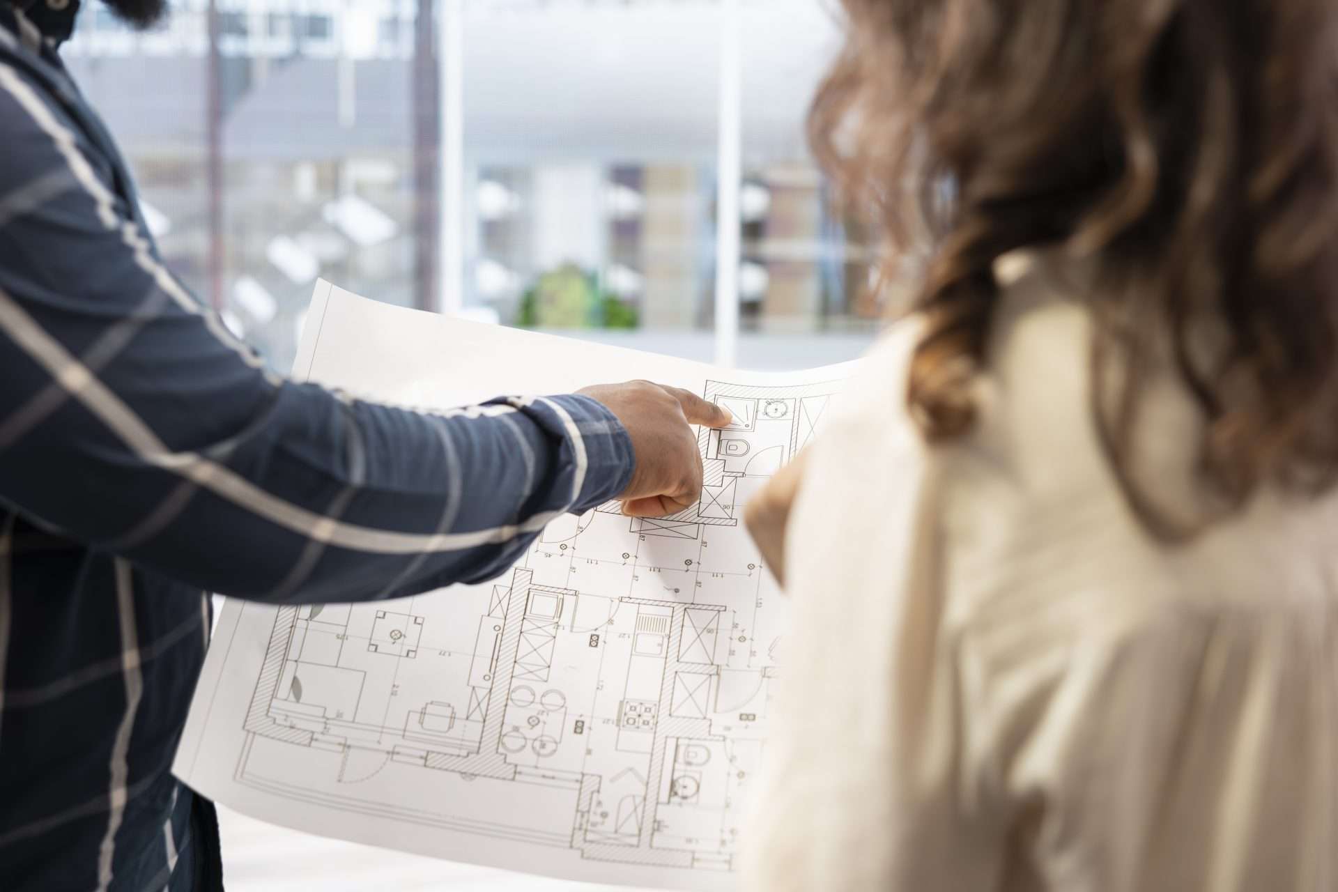 man using drafting services for project.