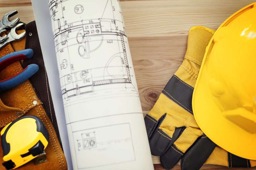architect using construction documentation for project.