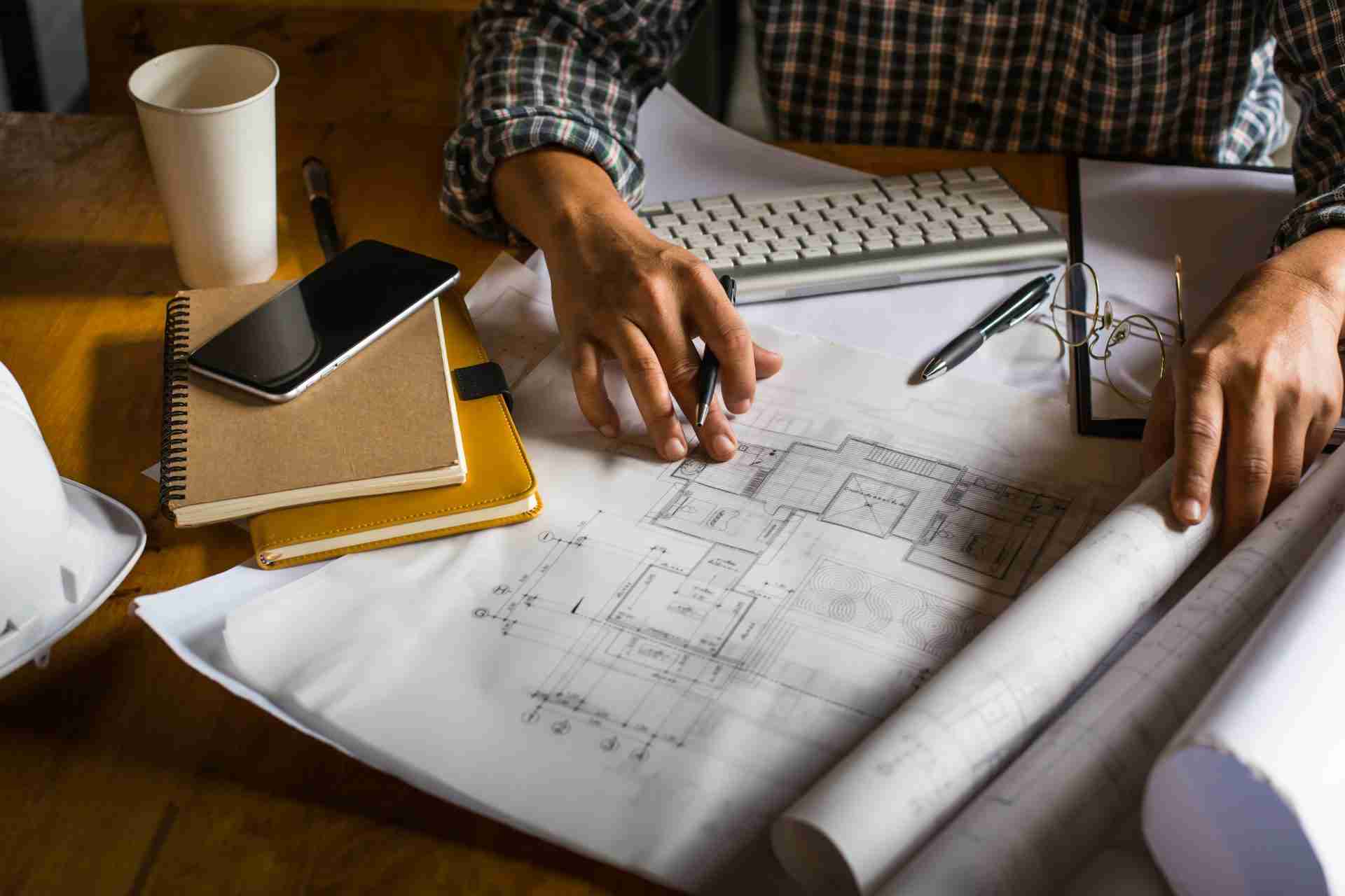 man using architectural design services for project.