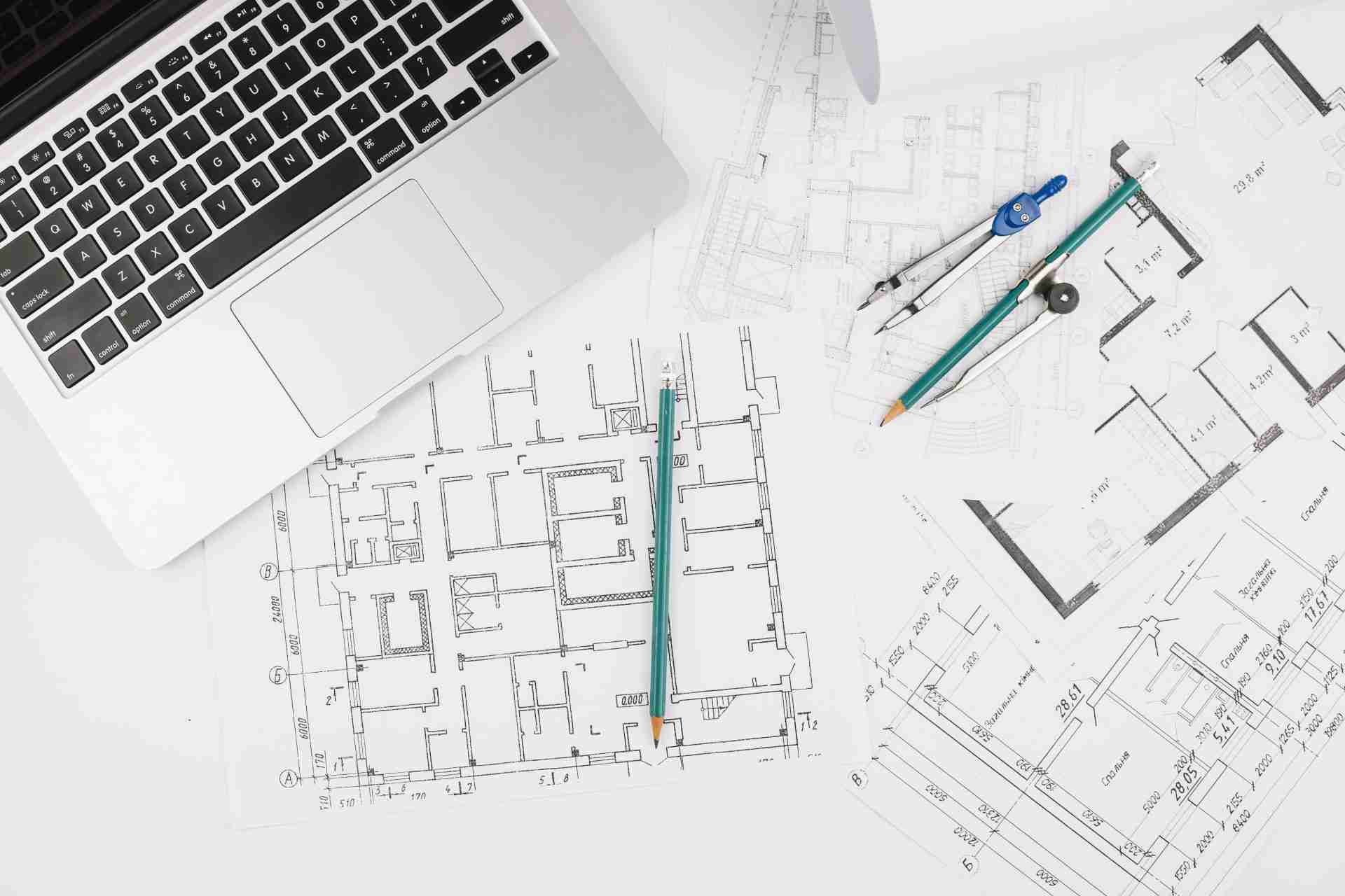 image of laptop with architectural sketches constructed using design drawings.