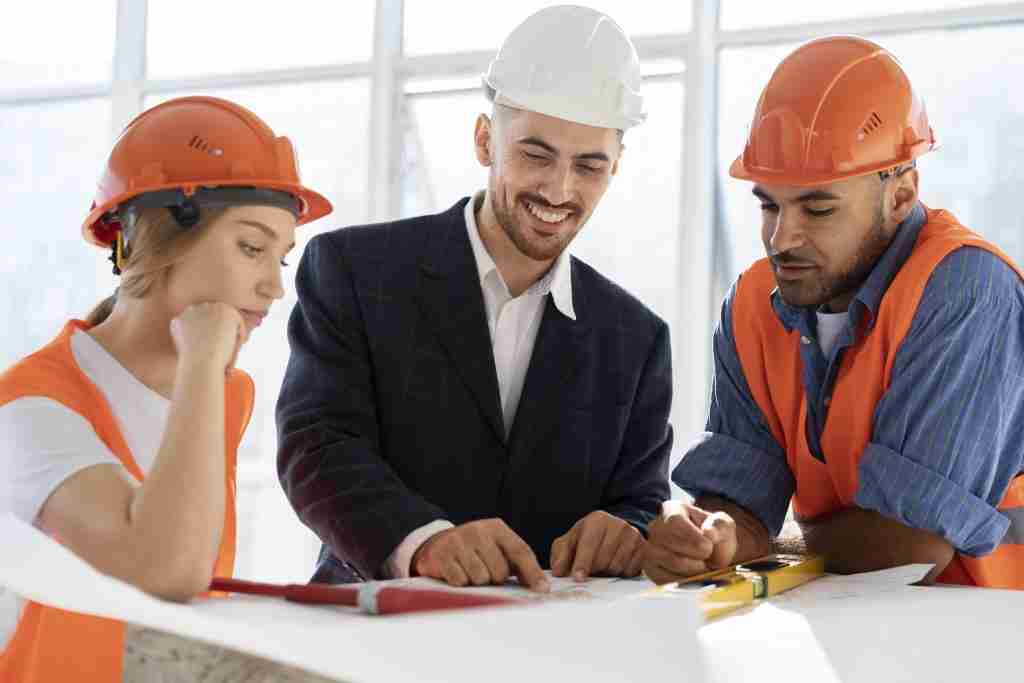 three construction workers signifying construction coordination.