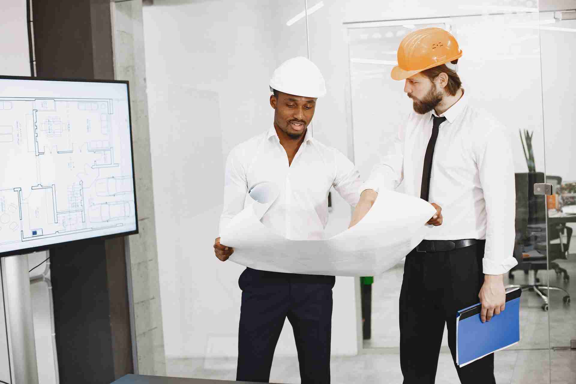 two architects discussing project with BIM consultant.