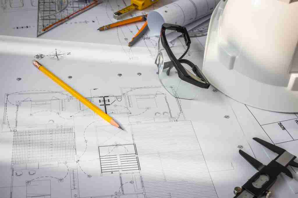 image of construction blueprints specifying the use of drafting services for building project.