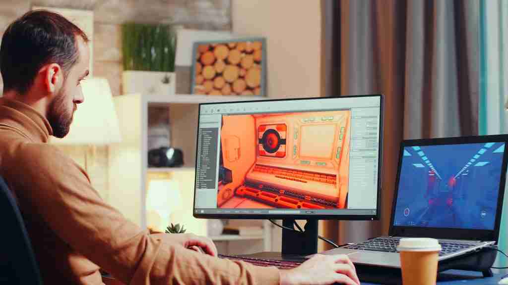 man using laptop for cad conversion services.