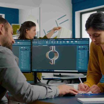 three architects implementing cad conversion services for construction project.